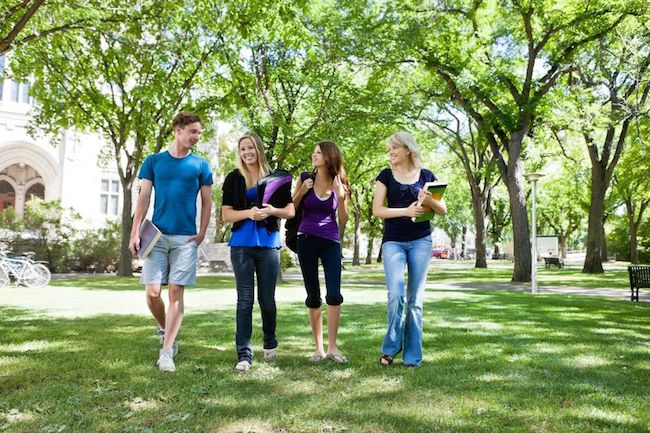 10723382 - group of college students walking in campus ground